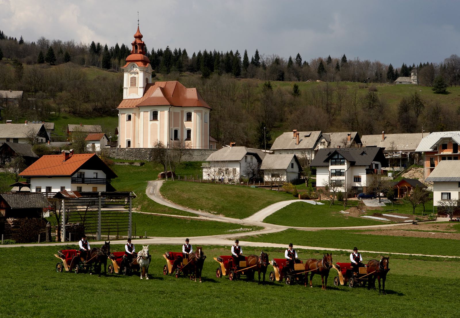 The Bled coachmen with their carriages in front of the village church